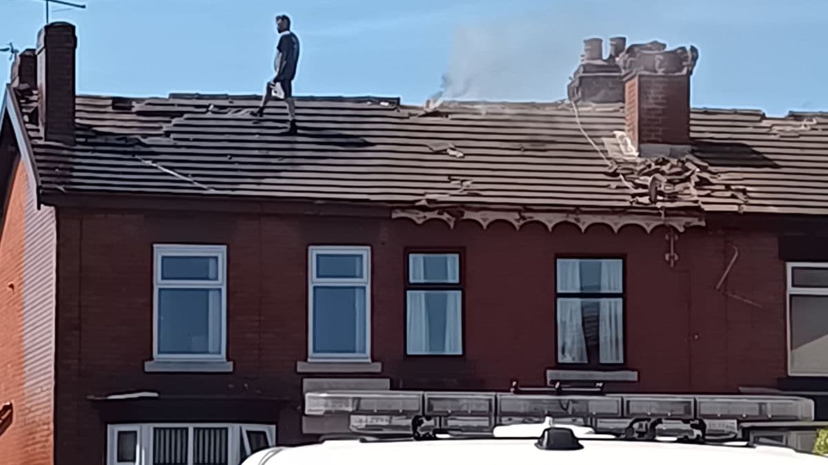 Man arrested following six-hour rooftop standoff and fires in Chorley